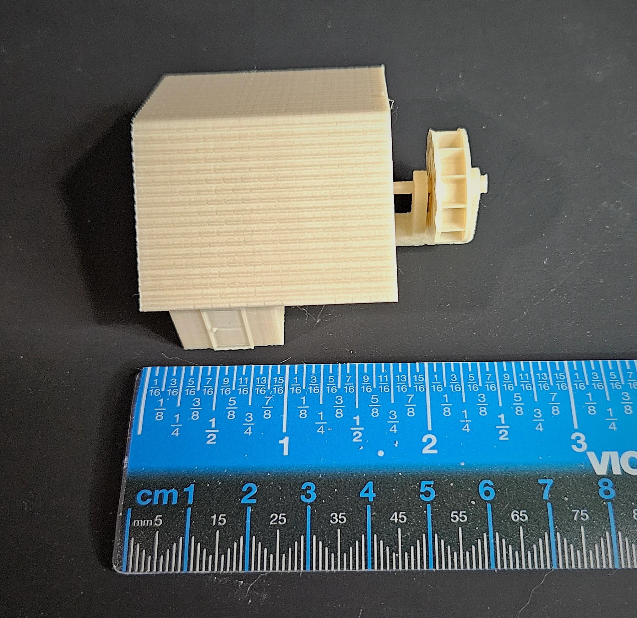 HO scale waterwheel with large building on display